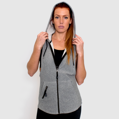 photo of model advance ladies sleeveless hoodie in grey. 