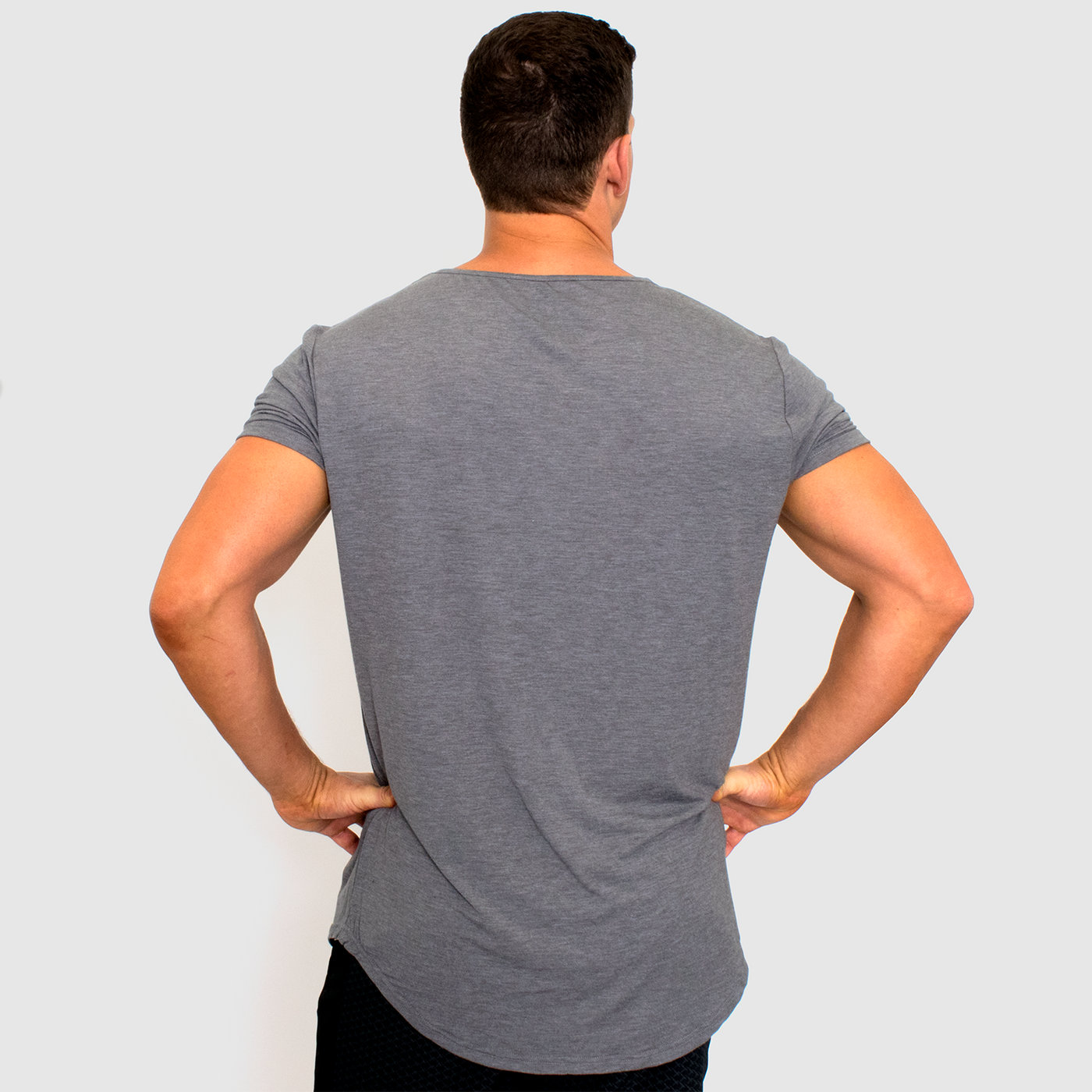 back view photo of model wearing advance mens elite team in grey heather.