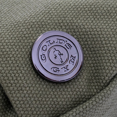 detail photo of golds gym weight plate logo metal accent on washed olive waist pack