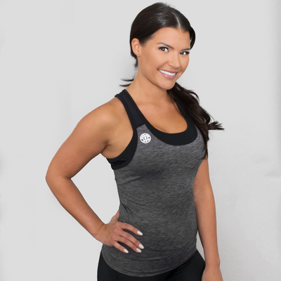 photo of model wearing advance racer panel tank in metal heather. golds weight plate logo in white on right upper chest. straps in black . 